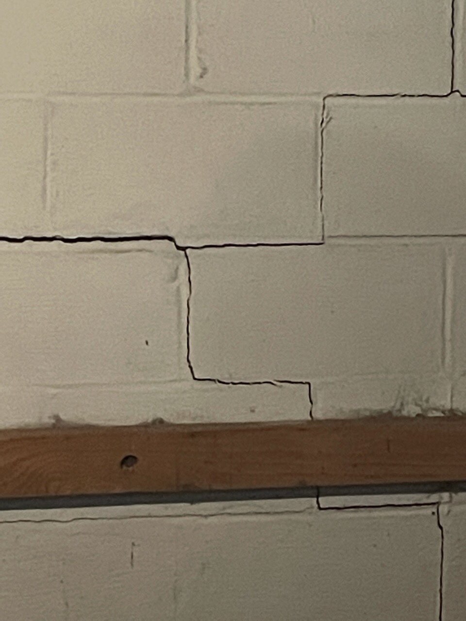 Step cracks in the foundation walls